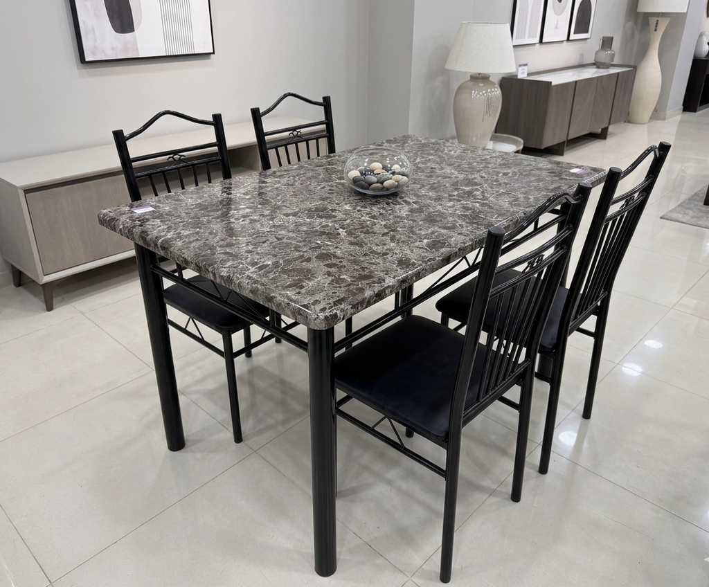 Dining table set with marble-like top and black chairs in a modern room.