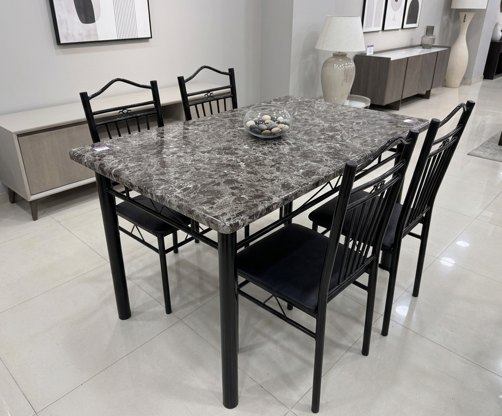 Dining table set with marble-like top and black chairs in a modern room.