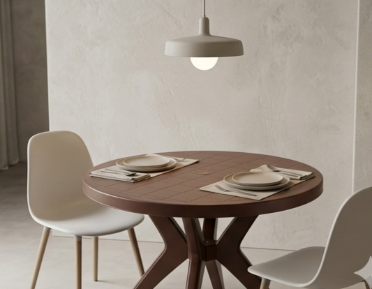 Dining table with chairs and place settings in a minimalistic room.