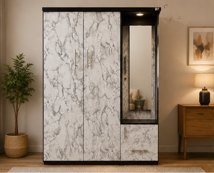 A tall three-door wardrobe with a white and gray marble-look finish and black trim, shown in a styled bedroom setting with a plant, wall art, and bedside lamp.