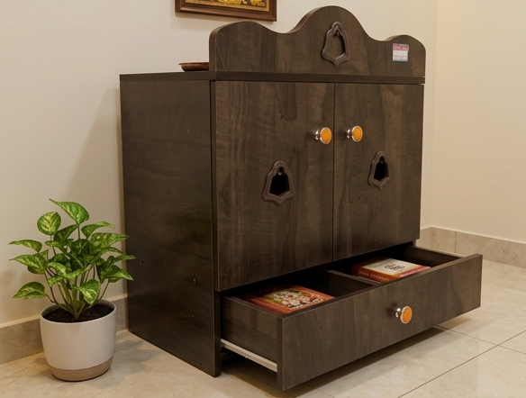 Wooden pet cabinet with multiple drawers and pet door designs, next to a potted plant.