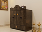 Brown wooden cabinet with decorative elements on a beige wall background