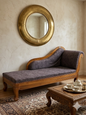 Collage of a wooden sofa in various home settings with decorative elements.